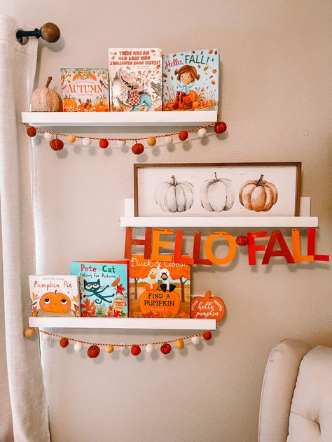 Fall books are from Amazon, Target and Walmart. Felt ball fall garland and the pumpkin canvas sign is from Homegoods and the “Hello Fall” banner is made using a cricut! Toddler Bookshelf, Crafts By Month, Fall Books, Pumpkin Canvas, Fall Tv, Fall Banner, Toy Display, Fall Garland, Toddler Fall