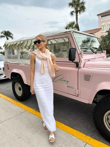 My outfit for a day in Palm Beach! I wore a white linen dress and tied a pink cashmere sweater around the neck (which I packed to wear with jeans too). Tap to shop and bring this fashion inspo to life! White Summer Dress Outfit, White Dress Outfit Summer, Palm Beach Fashion, Beach Style Outfit, Pink Cashmere Sweater, Florida Outfits, Midi Dress Outfit, Palm Beach Style, Bachelorette Outfits