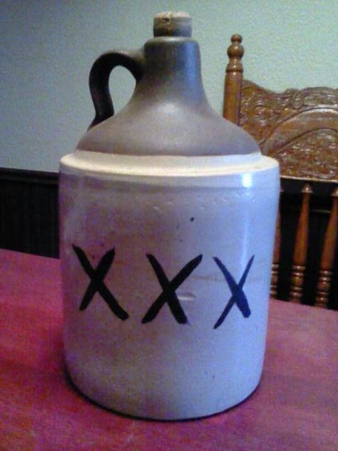 old moonshine jug Moonshine Tattoo, Moonshine Jug, Antique Crocks, Mountain Mural, Outside Bars, Gatsby Themed Party, Mining Town, Barn Dance, Stoneware Crocks