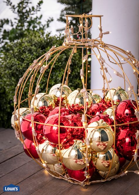 A beautiful red and gold lighted orb filled with ornaments is the perfect way to greet your guests for the holidays. Shop Christmas decorations to get your home holiday ready. Christmas Lawn Decorations, Ball Sculpture, Outdoor Christmas Planters, Old World Christmas Ornaments, Garden Christmas, Front Porches, Christmas Garden, Christmas D, Outdoor Christmas Lights