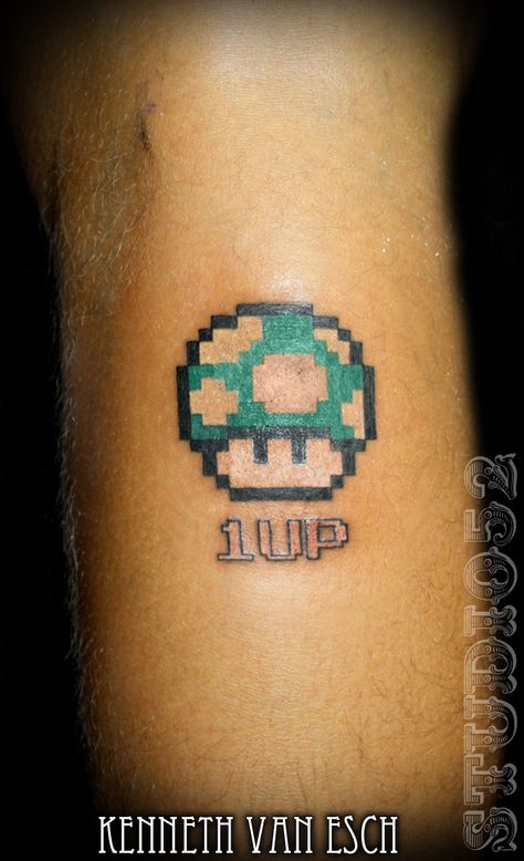 1up Mushroom by Kenneth Van Esch , Tattoo @ Studio 52, Seapoint Main Road, Cape Town. #Tattoos@52 #Studio52 1 Up Mushroom Tattoo, 1up Tattoo, 1up Mushroom, Pop Culture Tattoos, Nintendo Tattoo, Pokemon Tattoos, Pokemon World, Mario Tattoo, Culture Tattoos