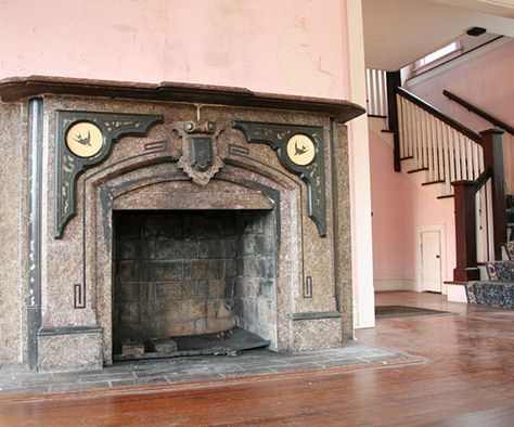 Before built-in storage and a drop zone were put in the entry area, the living room was an awkward space with lots of pink paint, much of it already peeling away. Tudor Renovation, Entry Area, Living Room Transformation, Tudor Style Homes, Drop Zone, Antique Fireplace, Tudor House, Tudor Style, After Pictures