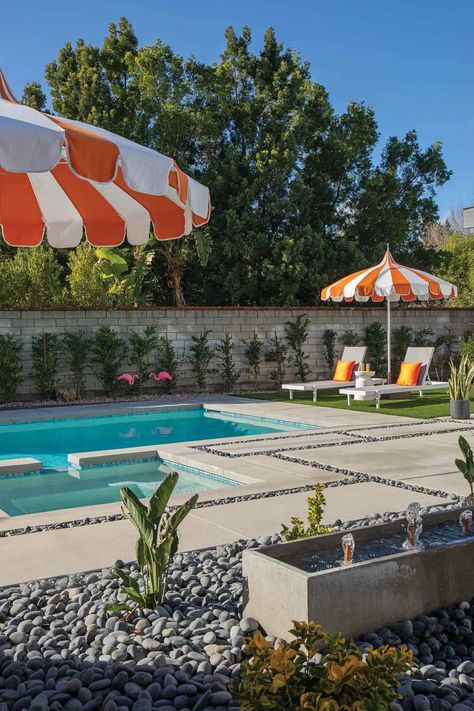 the pool area looks like a page out of a mid-century magazine. “The pool furnishings and décor were a late add, but I think they are just right to keep it feeling fresh, palm tree-ish and very Southern California back there!” Mid Century Modern Pool, Mid Century Pool, Mid Century Outdoor, Atomic Ranch, Modern Pool, Modern Pools, Pool Design, Flipping Houses, Outdoor Kitchen Design