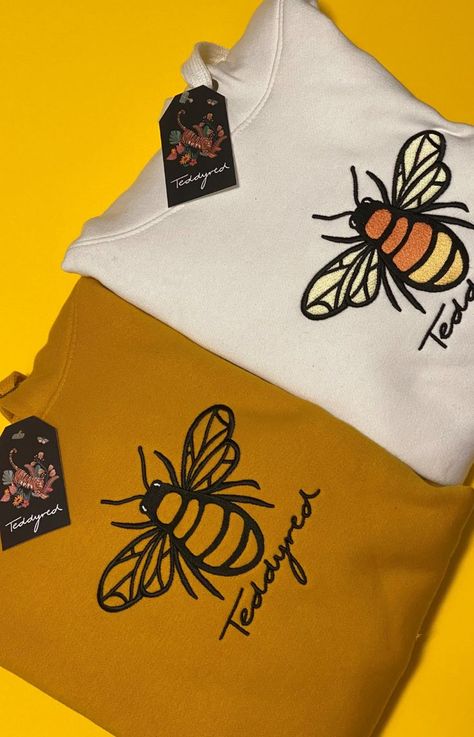 Teddyred bee hoodie with embroidery, mustard hoodie with bee logo and white hoodie with colourful bee embroidery. Teddyred is a premium UK loungewear brand selling high quality cozy pieces with beautiful designs Bee Hoodie, Light Blue Aesthetic, Loungewear Luxury, Bee Design, Embroidered Hoodie, Kangaroo Pouch, Casual Summer Outfits, Blue Aesthetic, White Hoodie