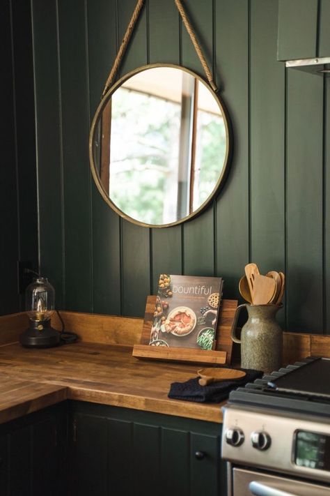 Dark Green Cabinets Kitchen Farmhouse, Emerald Green Kitchen Cabinets Butcher Block, Dark Green Kitchen Wood Counter, Dark Green Black And Wood Kitchen, Green Kitchen Cabinets Cabin, Dark Green Kitchen With Butcher Block, Black Kitchen Green Wall, Boho Kitchen Butcher Block Counter, Green Kitchen With Butcher Block Counters