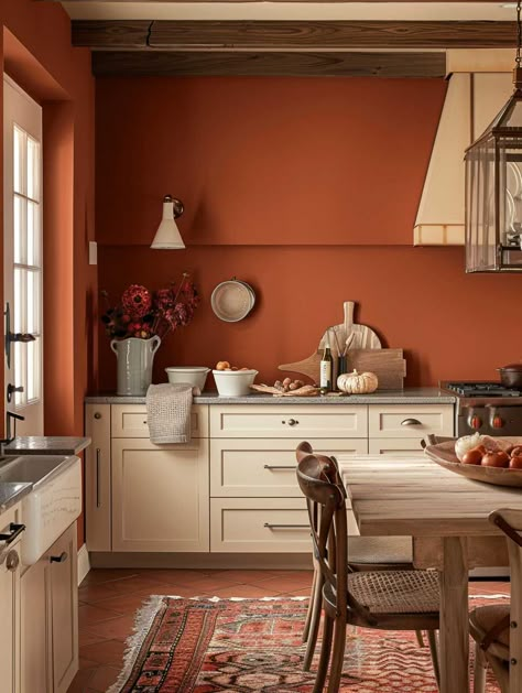 Explore Creative Home Interior Paint Ideas for Every Room • 333+ Art Images Orange Kitchen Walls Dark Cabinets, Kitchen Terracotta Walls, Light Kitchen Dark Walls, Attached Dining And Kitchen, Interior Paint For Small House, Color In The Kitchen, Orange Cupboards Kitchen Cabinets, Kitchen Interior Terracotta, Terracotta Accent Wall Dining Room