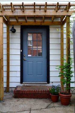 Arbor would be an awesome addition over the back door to provide some protection on the south side. Front Door Arbor, Front Door Trellis, Front Door Pergola, Door Arbor, Pergola Arbor, Door Trellis, Front Porch Pergola, Front Door Overhang, Door Pergola