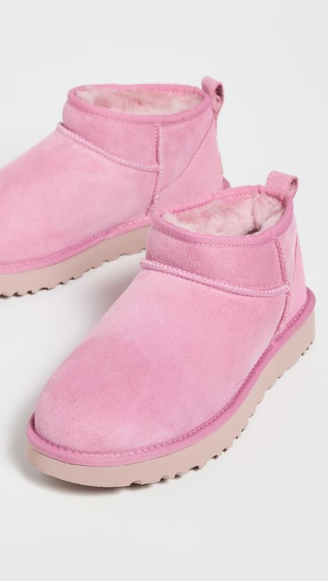 Find UGG Classic Ultra Mini Boots on Editorialist. Cannot be shipped outside the USA Dyed lamb shearling, from Australia. Upper: Sheepskin suede. Lining: Sherpa. Pull tab at heel. Wool lined footbed. No closure, pull-on design. Round toe. Rubber sole. Imported, Vietnam. This item cannot be gift-boxed.