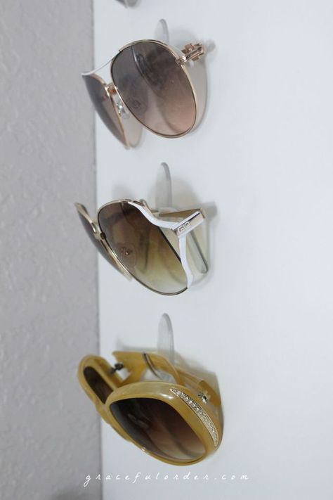 12 Ways to Organize with Command Hooks | Organizing Made Fun: 12 Ways to Organize with Command Hooks Diy Sunglasses Holder, Diy Sunglasses, Cheap Organization, Sunglasses Organizer, Sunglasses Display, Sunglasses Storage, Round Ray Bans, Command Hooks, Sunglass Holder