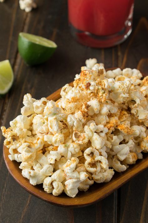 Mexican Popcorn is an easy and fun snack, or appetizer for the upcoming Cinco de Mayo celebration. Flavorful Mexican spices are sprinkled over warm, freshly popped popcorn and melted butter and a mixture of tangy, slightly salty cotija cheese and fresh lime zest is added for a lovely taste sensation. #mexicanpopcorn #popcorn #cotijacheese Mexican Popcorn, Savory Popcorn, Popcorn Toppings, Spiced Popcorn, Mexican Appetizers, Popcorn Recipe, Mexican Spices, Cotija Cheese, Appetizer Bites