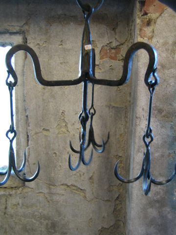 Chandelier made of meat hooks. Great Inspiration! Meat Hooks Butcher, Butcher Meat, Meat Hook, Pot Racks, Bacon Sausage, Display Jewelry, Chef Kitchen, Utility Hooks, S Hook