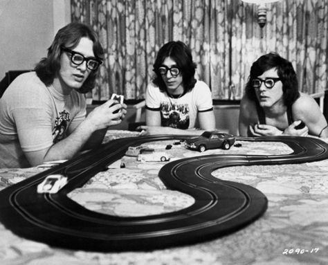 The "Hanson Brothers" race slot cars in their hotel room, from the hockey movie "Slap Shot". Slap Shot Movie, Hanson Brothers, Slap Shot, Slot Racing, Slot Car Racing, Sports Movie, Hockey Teams, Slot Cars, Classic Movies