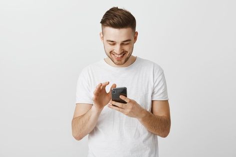 Free Photo | Modern stylish and pleased african american woman using wireless earphones while talking with clients holding smartphone making notes or picking music in device Person On Their Phone, People Using Phone, Staring At Phone, Thumbnail Poses, Person Holding Phone, Man Holding Phone, Captions For Guys, Asos Outfit, Holding Phone