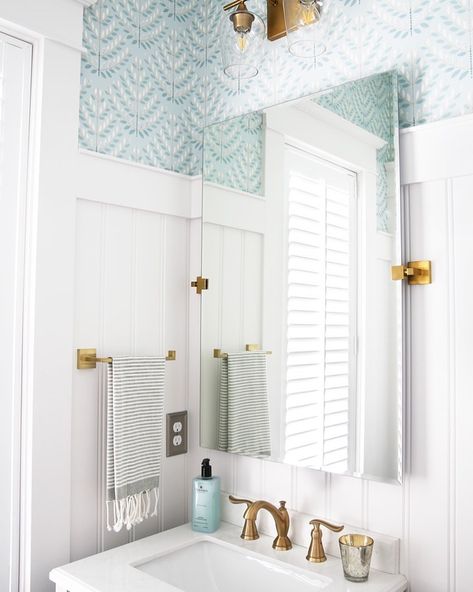 Abby Lawson - Abby Organizes on Instagram: “When I first started “adulting,” I didn’t really give much thought to our home’s decor. 🤷🏻‍♀️ It seemed like something extra that didn’t…” Organic Modern Coastal Decor, Coastal Modern Half Bath, Small Coastal Powder Room Ideas, Coastal Vibe Bathroom, Powder Room With Wainscoting, Condo Bathroom Design, Coastal Half Bath, Coastal Powder Room Ideas, Wallpaper In A Bathroom