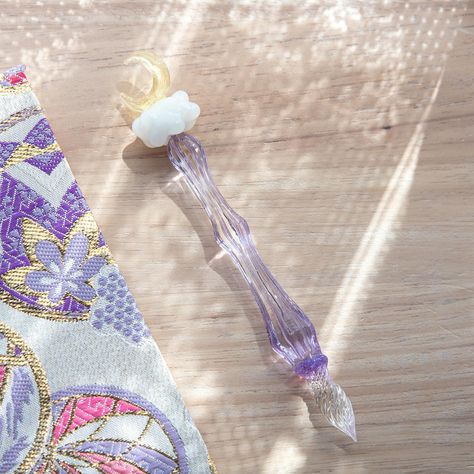 🌙✨Moonlit Cloud Japanese Glass Pen!✨🌙 Hello stationery lovers! Meet our Glass Pen, where artistry meets functionality. Imagine holding the twilight sky in your hand. The delicate cloud and moon motif adds a touch of enchantment to your writing experience. Whether you’re journaling or drawing, this pen adds elegance and inspiration to every stroke.🖋️ ✨ Let the Moonlit Cloud Glass Dip Pen bring a bit of magic to your daily writing. ✨ Tap @komorebistationery to see more glass pens. #glasspen... Cloud Japanese, Japanese Stationery Store, Cloud And Moon, Sky Drawing, Unicorn Glass, Glass Dip Pen, Glass Pen, Twilight Sky, Pen Brands