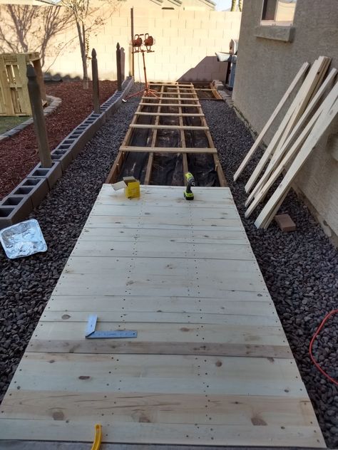 Pallet walkway How To Build A Boardwalk Wooden Walkways, Walkway With Pallets, Diy Side Walk Walkways, Diy Wooden Walkway, Diy Wood Walkway, Wooden Walkways Pathways, Wood Walkways Paths Diy, Pallet Walkway Ideas, Pallet Pathway Ideas