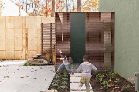 How This Landscape Design Made a Home as Fun as a Playground - Dwell Exterior Fence, Modern Courtyard, Outdoor Renovation, Front Fence, Ipe Wood, Backyard Renovations, Virginia Homes, Concrete Pavers, Fence Landscaping