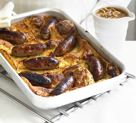 A British classic. Meaty sausages enveloped in crispy batter, plus, a special onion gravy to really top it off. We think it's better than mum's! Best Macaroni And Cheese, Toad In The Hole, Onion Gravy, Bbc Good Food, Bbc Good Food Recipes, English Food, British Food, Food Experiences, Easy Cocktails