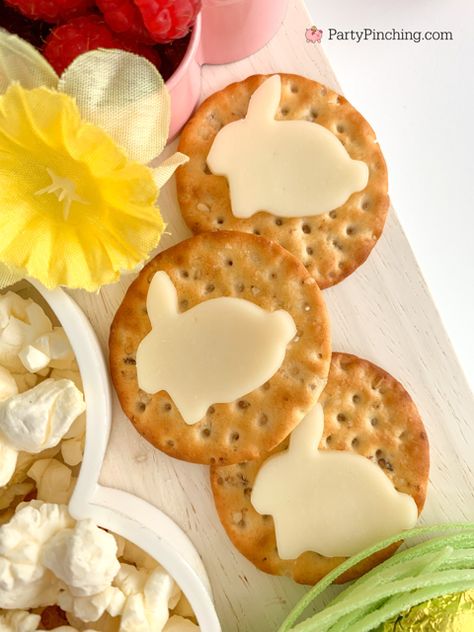 Easter snack board, Easter charcuterie board, Easter candy board, best charcuterie board ideas, best Easter charcuterie board, chocolate bunny charcuterie board, healthy charcuterie board for kids, cookie cutter charcuterie board, Easter candy charcuterie board, bunny cheese crackers, chocolate carrots, butterfly crackers, bunny cheese , foil covered eggs, R.M. Palmer Bunny Themed Appetizers, Bunny Shaped Food, Charcuterie Board Chocolate, Butterfly Crackers, Easter Snack Board, Charcuterie Board Healthy, Easter Candy Ideas, Charcuterie Board Easter, Bunny Charcuterie