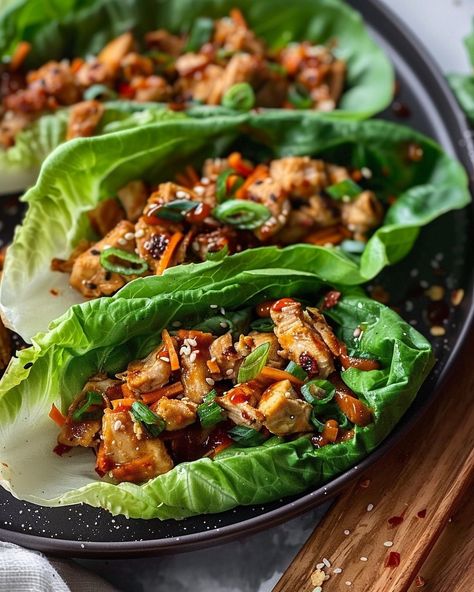 Light, refreshing, and packed with flavor - these Asian Chicken Lettuce Wraps are everything you need for a satisfying meal! Visit website for full recipe at https://northeastnosh.com/f/asian-chicken-lettuce-wraps #northeastnosh #asiancuisine #lettucewraps #thaifood #healthyrecipes #glutenfree #lowcarb #healthydinner #easyrecipes #quickmeals #mealprep #dinnerideas #cleaneating #foodie #homemade #nutrition Sweet Red Chili Sauce, Korean Meals, Thai Chicken Lettuce Wraps, Asian Chicken Lettuce Wraps, Main Entrees, Creamy Mushroom Sauce, Chicken Lettuce Wraps, Asian Chicken, Recipes Appetizers And Snacks