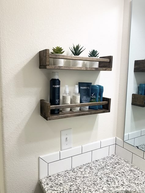 The IKEA Bekvam spice rack is a cheap solution to a lack of bathroom storage. My husband’s sink doesn’t have a drawer so we bought this spice rack and stained it to match our cabinets. No more mess on the counter! #winwin Ikea Spice Rack As Shelf, No Cabinet Bathroom Storage, Ikea Restroom Ideas, Small Sink Storage Bathroom, Bathroom Shelf By Sink, Bathroom Shelves By Sink, Bathroom Ikea Shelf, Ikea Spice Rack Bathroom, Floating Shelves Bathroom Sink