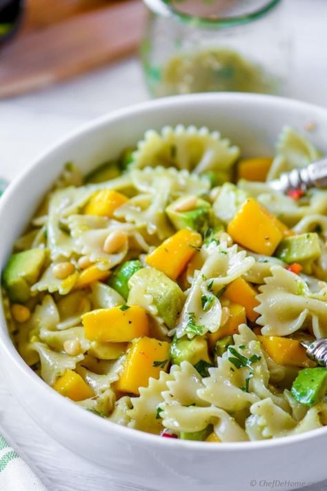 Mango Avocado Pasta Salad with Cilantro Lime Dressing Healthy fresh take on pasta salad with creamy avocado, sweet mangoes and zesty flavorful cilantro-lime dressing. Every fork-full of this pasta salad has something delicious to enjoy - lime-soaking creamy avocados, juicy mangoes, pasta, and crunchy pine nuts.  #mango #avocadosalad #pastasalad #pasta Cilantro Lime Dressing Recipe, Salad With Cilantro Lime Dressing, Pasta Salad Dressing Recipe, Mango Guacamole, Salad With Mango, Mango And Avocado, Avocado Recipes Easy, Vegetarian Pasta Salad, Avocado Pasta Salad