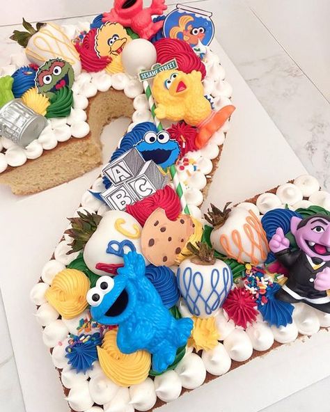 Sesame Street Cupcakes Ideas, Sesame Street Number Cake, Homemade Sesame Street Cake, Elmo Number Cake, Sesame Street Cupcake Cake, Pastel Sesame Street Party, Sesame Street Birthday Ideas, Sesame Street Pull Apart Cupcake Cake, Sesame Street 2nd Birthday Cake