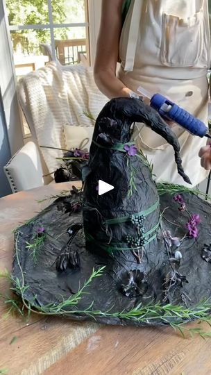 30K views · 1.4K reactions | It’s a witches hat made from leftover napkins, bits from other craft projects, discarded party decor, black painted artificial flowers from last years Halloween decor, tape, string, and glue. #diywitchhat #halloweendiy #witch #witchcraft #artsandcrafts #witchhat #diy #hallloweencraft #witches | Home Beam DIY Diy Witch Hat Decor, Easy Halloween Decorations, Witch Diy, Halloween Silhouettes, Easy Halloween, Witch Hat, Hat Making, Black Paint, Halloween Diy