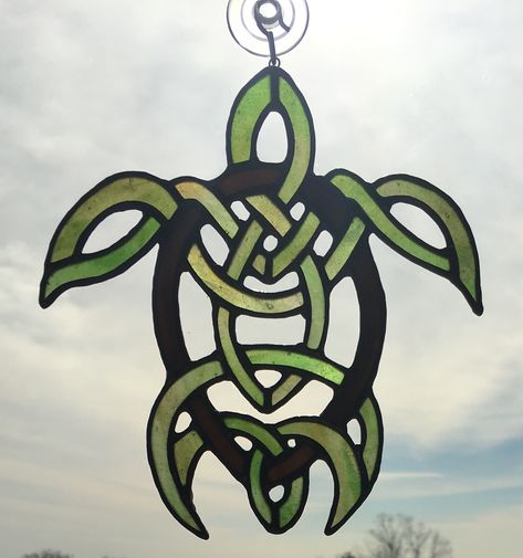 Celtic sea turtle stained glass suncatcher. $95. AVAILABLE Celtic Turtle Tattoo, Celtic Stained Glass Patterns Irish, Celtic Stained Glass Patterns, Turtle Tattoos For Women, Celtic Turtle, Stained Glass Turtle, Celtic Stained Glass, Celtic Artwork, Turtle Tattoo Designs