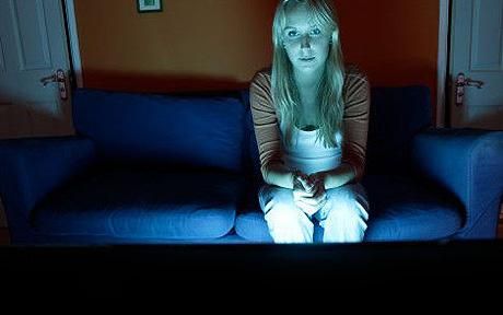 Woman watching tv, television, ont he sofa, couch in dark living room: BBC's share of TV viewers falls to new low Blue Cross Blue Shield, San Diego State University, Sleep Problems, Real Friends, Dark Room, Health Advice, Watching Tv, Womens Health, Blue Light