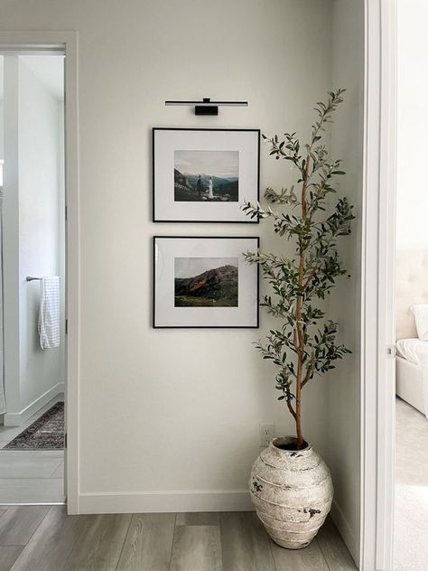 A picture of a modern and simply decorated corner inside a home or apartment. Living Room Decor Ideas Minimalist, Wall Drawing Bedroom, Room Decor Ideas Minimalist, Living Room Inspiration Minimalist, Room Inspiration Minimalist, Tile To Wood Transition, Couch Inspiration, Living Room Ideas Minimalist, Couch Styles