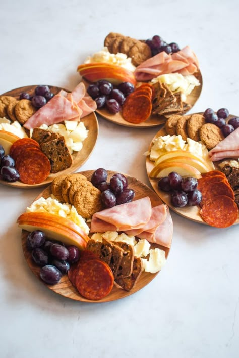 Cheese board for one, please! Make individual cheeseboards and create a fantastic first course, appetizer, heavy hors d'oeuvre, or the best snack ever! Simple cheeses, meats, fruits, and crackers are displayed on small wooden plates. Small Appetizer Table Display, Individual Antipasto Plate, Individual Grazing Boxes, Individual Appetizers, Grazing Boxes, Charcuterie Board Ideas, Food Boards, Charcuterie Plate, Fingerfood Party