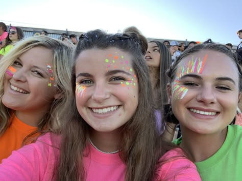 Neon Football Game Theme Face Paint, Neon Football Game Face Paint, Neon Spirit Week, Neon Face Paint Ideas For Football Games, Spirit Week Makeup, Pep Rally Makeup Face Paintings, Colorguard Makeup Looks, Hoco Game Face Paint, Neon Football Game Theme Outfit Paint