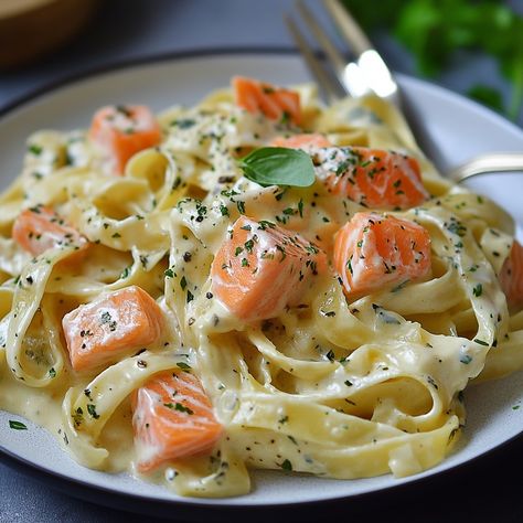 🍝🐟 Tagliatelle Pasta with Melting Leeks and Salmon 🍝🐟 Ingredients: 300g tagliatelle 2 leeks, washed and sliced 200g fresh salmon, cut into pieces 200ml double cream 1 tbsp olive oil 1 tbsp butter 1 clove garlic, minced Zest of 1 lemon Salt and pepper to taste Chopped fresh parsley to garnish Instructions: Cooking the tagliatelle: Cook the tagliatelle in a large pan of boiling salted water according to the packet instructions. Drain and set aside. Preparing the leeks: In a large frying pan, he... Tagliatelle Pasta, Fresh Salmon, Healthy Food Menu, Food Program, Salmon Pasta, Double Cream, Lemon Salt, Salty Foods, Dinner Appetizers