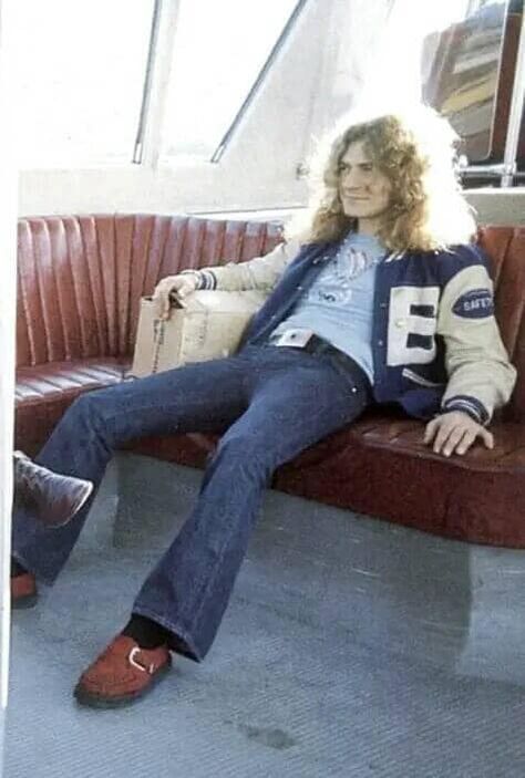 Robert Plant with Led Zeppelin traveling by train in  in his letterman jacket - Japan, 1972. Robert Plant 70s, Traveling By Train, 70s Men, Guy Fits, 60s 70s Fashion, Led Zep, 70s Inspired Fashion, 70s Outfits, Mens Outfit Inspiration