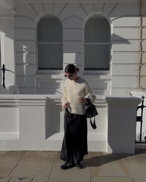 Long Black Silk Skirt Outfit Winter, Black Silk Skirt Outfit Winter, Silk Midi Skirt Outfit Winter, Black Silk Midi Skirt Outfit, Cream Jumper Outfit, Silk Skirt Outfit Winter, Jumper Skirt Outfit, Midi Skirt Styling, Silk Midi Skirt Outfit