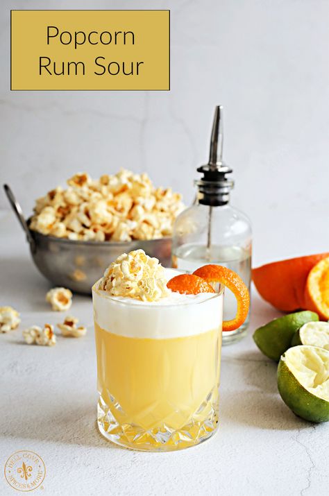 The popcorn rum sour combines the classic sour cocktail elements of sweet and citrus with a popcorn infused simple syrup. Popcorn Cocktail, Sour Cocktail Recipes, Rum Sour, Infused Simple Syrup, Cocktails Aesthetic, Popcorn Recipes Easy, Flavored Alcohol, Sweet Popcorn, Popular Cocktails