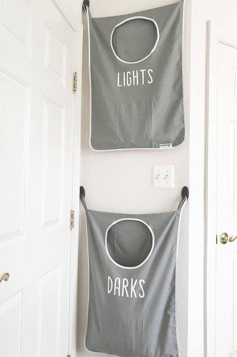 Labeling Wall-Mounted Laundry Room Organizers - Wall organizers for your laundry room might just change your life. From eliminating piles of dirty laundry on the floor to giving all your laundry supplies an orderly home, you will be amazed at how much difference a few simple upgrades can have on your laundry routine. Check out these 20 great ways to transform one of your household’s messiest chores into something you might even begin to enjoy. Laundry Bags Diy, Hanging Laundry Bag, Sorting Clothes, Laundry Shelves, Laundry Sorting, Hanging Laundry, Van Storage, Camper Storage, Laundry Room Inspiration