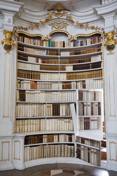 Jorge Royan / Via commons.wikimedia.org. Concave secret bookcase door + antique books + monastery environment = awesome. This secret bookcase door is inside Admont Abbey Library in Admont, Austria. I see a staircase there, I wonder where it leads? Bookcase Doors, Secret Doors, House Castle, Lots Of Books, Bookcase Door, Aesthetic Interior, Books Decor, Dream Library, Beautiful Library