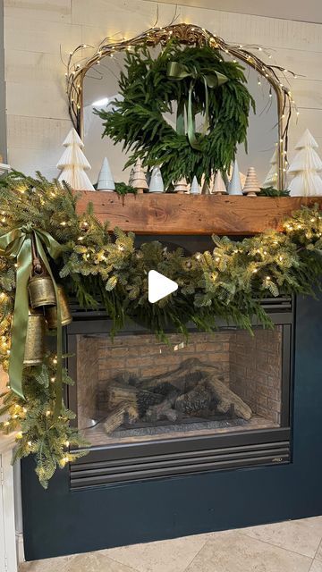 Jodie Kammerer • AMAZON HOME FINDS on Instagram: "Comment for links! (Decor & tools used)  Here’s how I decorated my Christmas Mantel:  1) I hung 2 garlands (one 10ft and one 6ft) and connected them with zip ties.  2) I hung the garland on 15lb command hooks.  3) I strung together a set of 3 brass bells and connected them all with zip ties.  4) I added a moss colored 2” satin ribbon and connected it with a zip tie.  Voila!🎄Not hard at all!  Stay tuned for PART 2 of my mantel decor!  #christmasdecor #christmasinspo #christmasdecorations #christmasmantel #manteldecor" Bells On Mantle Christmas, Christmas Mantel With Bells, Christmas Mantle With Bells, Garland With Bells, Garland On Mantle, How To Hang Garland On Mantel, Mantel Wreath, Decorating Mantels, Wreath Mirror