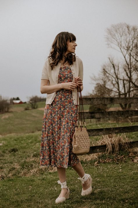 How to style a floral dress for spring, cotton cardigan, straw bag, espadrilles. #sezane #springoutfit #springdress #summerdress Midi Dress Cardigan Outfit, Summer Dress And Cardigan, Spring Dresses Floral, Floral Dress And Cardigan Outfit, Spring Dress With Cardigan, Midi Dress With Cardigan Outfit, Dress And Cardigan Outfit Summer, Floral Dress With Cardigan, Summer Dress With Cardigan