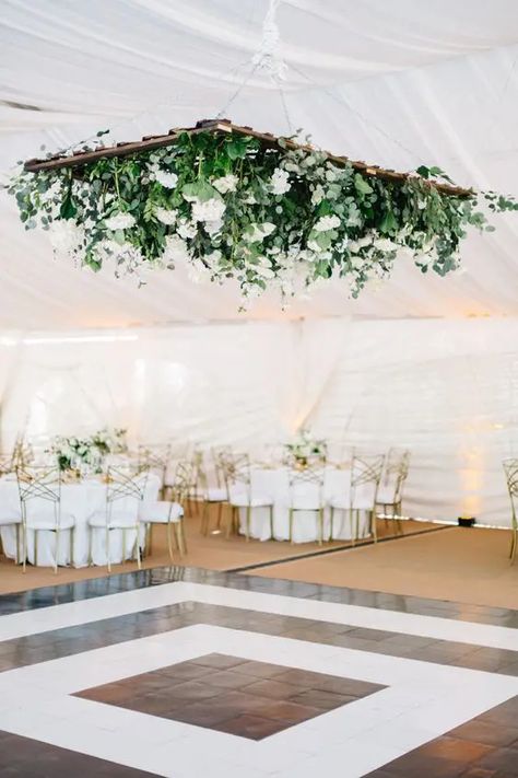 Picture of a modern black and white dance floor, with a large greenery and white bloom chandelier over the space Wedding Dance Floor Ideas, Dance Floor Ideas, Black And White Dance Floor, Black And White Dance, Wedding Car Deco, White Dance Floor, Wedding Tent Decorations, White Dance, Flower Ceiling