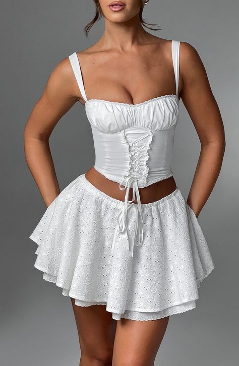 We need ALL the cute minis in our wardrobe rn. Made in our prettiest floral broderie anglaise, this circle shape skirt is super fun and flirty, complete with a drawstring waistband and lace trim to the hem. Pair yours with the matching Wilma corset and glowing make up.     Colour: Ivory.  Premium floral broderie anglaise cotton.  Fully lined.  Circle shape skirt.  Voluminous.  Drawstring waistband.  Tie to centre front.  Lace trim to lining hem.  Mini length.  Model is an XS and is wearing an XS Homecoming Dresses Corset, Long Sleeve Homecoming Dresses, White Floral Skirt, Split Long Dress, Mule Heels, Homecoming Dresses Long, Maxi Dress Sale, Popular Dresses, Sparkle Dress