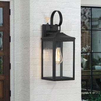 True Fine Norwich 1-Light 18-in H Black Dusk to Dawn LED Outdoor Wall Light in the Outdoor Wall Lights department at Lowes.com Exterior Light Fixture Over Front Door, Black Farmhouse Outdoor Light Fixtures, Black Outside Lights, Outdoor Light Fixtures Garages, Outdoor Wall Lights On House Garage, Door Lights Exterior, Outside Lights Front Door, Garage Door Lights Exterior, Outdoor Wall Sconces Exterior Lighting