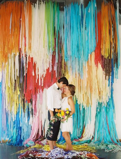 scene-stealing backdrop, photo by Ben Q Photography, backdrop by The Color Condition http://ruffledblog.com/color-pop-wedding-ideas #backdrops #weddingideas #garlands Decor Photobooth, Diy Streamers, Colorful Backdrop, Photo Booth Backdrop Wedding, Streamer Backdrop, Booth Backdrops, Diy Wedding Backdrop, Fringe Backdrops, Practical Wedding