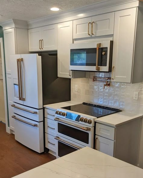 Stove By Refrigerator, Stove Refrigerator Same Wall, White Microwave Above Stove, Ge Cafe Microwave, Pot Filler Over Electric Stove, Pot Fillers Over Stove With Microwave, Por Filler Kitchen, Pot Filler With Microwave Above, Stove With Water Faucet