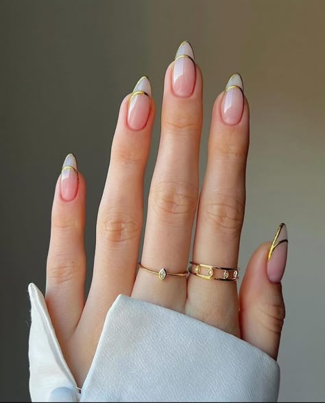 Save this pin for trendy French tip nail designs inspired by the runway to elevate your everyday style! 💅✨ #FrenchTipNails #NailArtInspo #FashionBlog #NailTrends French Manicure Nails With Gold, French Tip Nails 2025, French Tip Nails Gold Accent, French Nails With Design Creative, French Inspired Nails, French Tips With Gold Design, French Nails 2025, French Tip Nails With Gold Line, French Nails Design Elegant