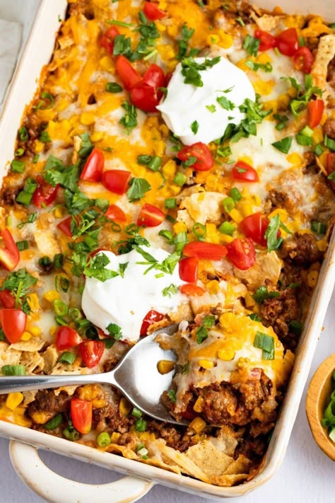 This easy taco casserole recipe gives you all the flavors you would want from a taco in one convenient dish. It's perfect for busy weeknights and much less work than a taco bar! Recipe With Corn, Easy Taco Casserole, Taco Bake, Taco Casserole, Easy Taco, Enchilada Casserole, Mexican Food Recipes Easy, Corn Chips, Tacos Beef