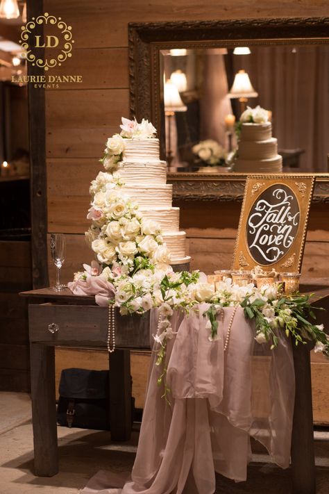 5-tier white wedding cake with cascasding roses on a vintage wood table for this navy blue and blush elegant, chic barn wedding held at Terian Farms in Nashville Wedding Cake Tables Displays, Decorating Cake Table For Wedding, Table Cake Decoration Ideas Wedding, Bridal Cake Table Decorations, Engagement Cake Table Decor, Cake Table Wedding Elegant, Wedding Cake Table Ideas Display, Wedding Cake Set Up Display, Brides Cake Table Ideas