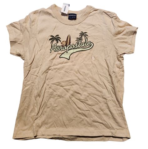 Nwt Vintage Y2k Aeropostale Women's T-Shirt Size Large Tomboy Fit Light Tan With Monkey And Surfboard, And Aeropostale In Glitter On Front Pit To Pit: 20 1/2" Length: 21" 100% Cotton This Is A Super Cute Shirt! Smoke-Free And Pet-Free Home Offers Welcome! Bundle And Save! Fast Shipping! 5-Star Seller! Bedazzled Pants, Aeropostale Outfits, Poshmark Clothes, Y2k Ideas, Tomboy Fits, Tomboy Shirts, Jeans Unique, Y2k Aeropostale, Unique Jeans